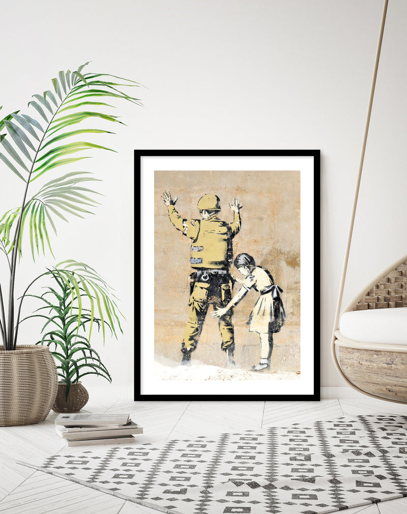 Girl Searching Solider Art Print by Banksy | Banksy Art NZ | The Good Poster Co.