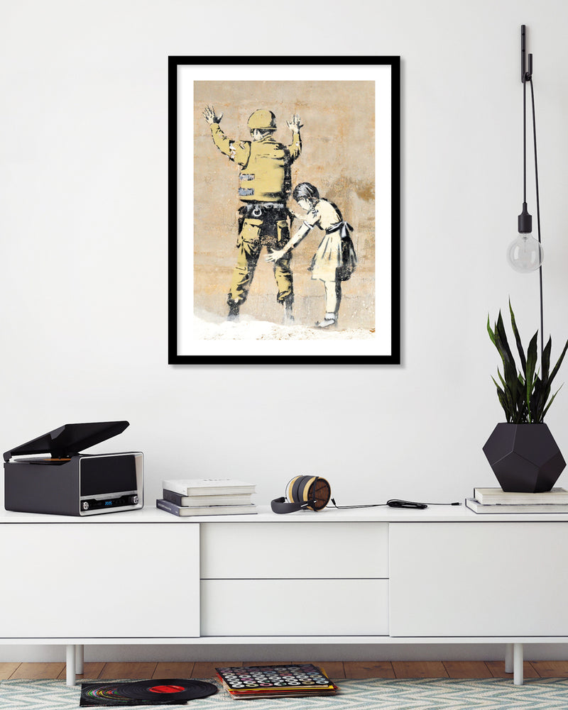 Girl Searching Solider Art Print by Banksy | Banksy Art NZ | The Good Poster Co.