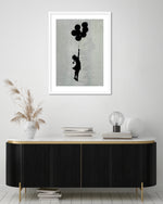 Girl Flying with Balloons Art Print by Banksy | Banksy Posters | The Good Poster Co.